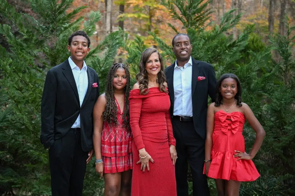 Atlanta family posing next to their house in North Georgia for family portraits