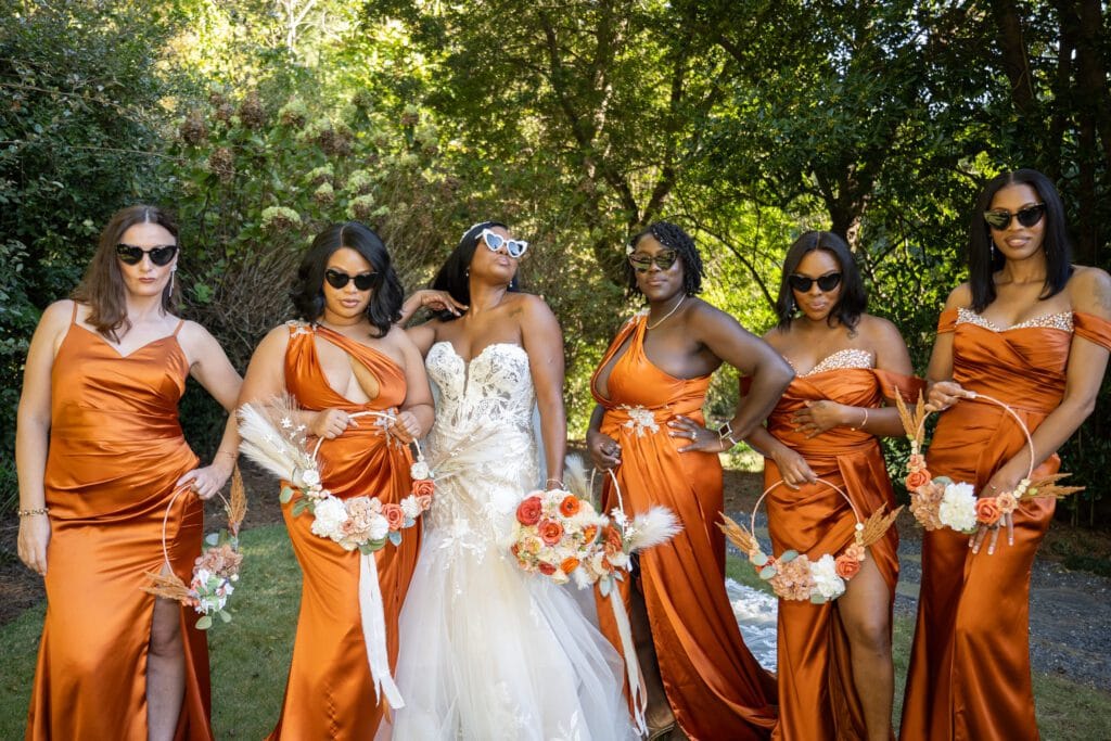 Bride having fun after the ceremony with the braidmates